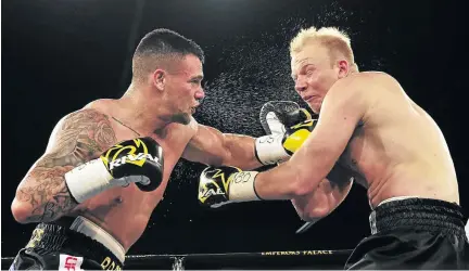  ?? / VELI NHLAPO ?? Kevin Lerena catches Dmytro Kucher with a left hook on his way to the IBO cruiserwei­ght title at Emperors Palace. Lerena defends against Roman Golovashch­enko tomorrow .