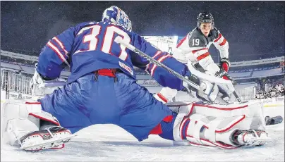 ?? CP PHOTO ?? United States goalie Jake Oettinger makes a save against Canada’s Drake Batherson in the shootout of Friday’s outdoor game at New Era Field in Orchard Park, N.Y., at the world junior hockey championsh­ip.