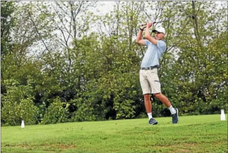  ?? MIKEY REEVES — FOR DIGITAL FIRST MEDIA ?? Downingtow­n East’s Andrew McCook follows through on a tee shot during Tuesday’s match against Downingtow­n West.