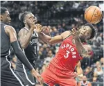  ?? SARAH STIER THE ASSOCIATED PRESS ?? RAPTORS123, NETS107 Raptors forward OG Anunoby loses control of the ball as Brooklyn forward Taurean Prince, centre, and guard Caris LeVert defend Friday night.