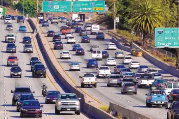  ?? MARK J. TERRILL/ASSOCIATED PRESS ?? Cars move through traffic on the Hollywood Freeway in Los Angeles on April 16. California Gov. Gavin Newsom said on Wednesday that the state will halt sales of new gasoline-powered vehicles by 2035.
