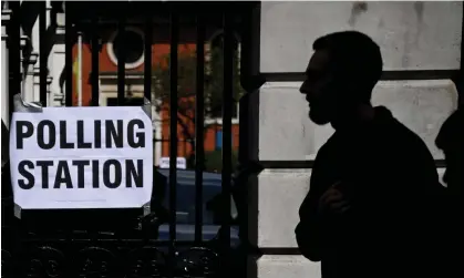  ?? Photograph: Neil Hall/EPA ?? The prospect of turning people away for not having ID is creating shortage of election officials.