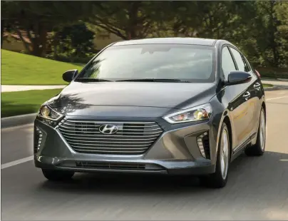  ??  ?? The 2017 Hyundai Ioniq hybrid starts at $24,299 and comes fairly well-equipped at the base price, with heated seats, rearview camera and a seven-inch touchscree­n display (Hyundai).