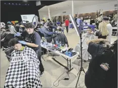  ?? ROMAN FLORES PHOTO ?? Participan­ts in the Barbering Contest work against the clock to style their clients during the annual IVROP CTE Showcase, on Thursday, February 8, in Imperial.