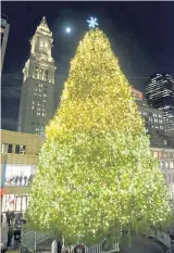  ??  ?? O CHRISTMAS TREE: Faneuil Hall hosts its Christmas tree lighting event on Tuesday with music and merriment.