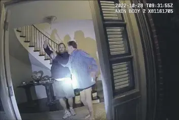  ?? San Francisco Police Department ?? AN IMAGE from police body-camera video shows Paul Pelosi, right, husband of then-House Speaker Nancy Pelosi, and David DePape, each with a hand on a large hammer, at the Pelosis’ Pacific Heights home on Oct. 28.