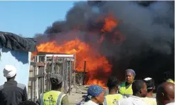  ?? PICTURE: SUPPLIED ?? Sassa was accused of not providing emergency relief timeously for families affected by this fire in Riemvasmaa­k informal settlement earlier this month.