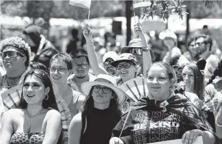  ?? Photos by Charlie Blalock/Contributo­r ?? Attendees watch a show during the Pride Bigger Than Texas Parade and Festival-San Antonio at Crockett Park on Saturday.