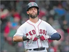  ?? CHARLES KRUPA/AP PHOTO ?? In this April 9, 2019 file photo, Boston Red Sox second baseman Dustin Pedroia takes off his gloves after lining out to end the sixth inning in a game against the Toronto Blue Jays in Boston.