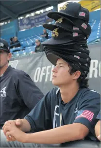  ?? Jayne Kamin-Oncea /For The Signal ?? West Ranch pitcher Timmy Josten wears a stack of rally caps as during a baseball game in May 2016 during the semifinal playoffs against Murrieta Mesa.