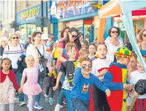  ?? Picture: Sarah Burns. ?? Walking on sunshine – Some of those who took part in the parade at Cupar Summer Fayre.