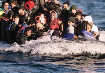  ?? AFPPIX ?? Refugees arrive on the Greek Lesbos island after crossing the Aegean Sea from Turkey on Monday. More than 218,000 migrants crossed the Mediterran­ean to Europe in October – a monthly record and more than during the whole of 2014, the United Nations said.