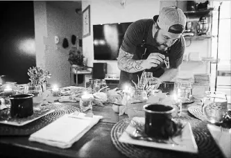  ?? DARRYL DYCK
THE CANADIAN PRESS ?? Chef Travis Petersen uses a dropper to add THC distillate to an amuse bouche of toasted farro and young pine broth before guests arrive for a multi-course cannabis-infused meal in Vancouver.