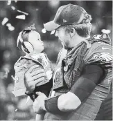  ?? ROB CARR GETTY IMAGES ?? Nick Foles celebrates with his daughter Lily Foles after the Eagles 41-33 victory over the New England Patriots in Super Bowl LII.