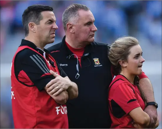  ??  ?? Wexford town native Frank Browne (centre), a former member of the Sarsfields and Faythe Harriers clubs, with some fellow mentors after the Mayo ladies’ football side he manages lost the TG4 All-Ireland final to Dublin in Croke Park on Sunday by 4-11 to...