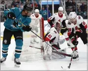  ?? JOSIE LEPE — THE ASSOCIATED PRESS ?? The Sharks’ Evander Kane, left, take a backhand shot on Senators goalie Craig Anderson during Saturday’s loss.