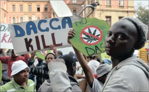  ?? PICTURES: OUPA MOKOENA ?? DAGGA IS GAGGA: People opposed to the use of dagga protest outside the high court in Pretoria yesterday.