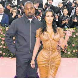  ?? FILE ?? Kim Kardashian West (right) in February filed for divorce from Kanye West (left) after 6 1/2 years of marriage.