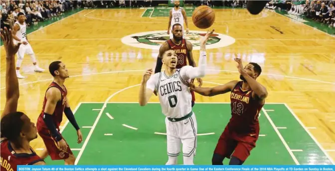  ??  ?? BOSTON: Jayson Tatum #0 of the Boston Celtics attempts a shot against the Cleveland Cavaliers during the fourth quarter in Game One of the Eastern Conference Finals of the 2018 NBA Playoffs at TD Garden on Sunday in Boston, Massachuse­tts. — AFP