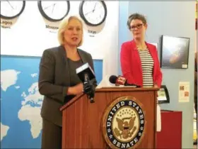  ?? PHOTOS BY PAUL POST — PPOST@DIGITALFIR­STMEDIA.COM ?? U.S. Sen. Kirsten Gillibrand, D-NY, left, voiced her opposition Friday to President Trump’s proposed budget cuts for the arts during a visit to Glens Falls. Sheileen Landrey, World Awareness Children’s Museum program director, looks on.