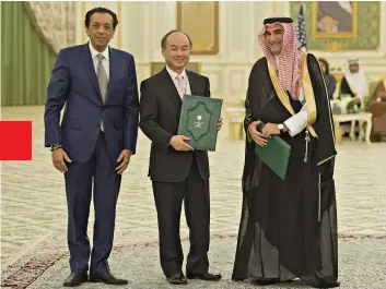  ??  ?? Friends Like These SoftBank’s Rajeev Misra (left) and Masayoshi Son (middle) with their key Vision Fund backer, the governor of Saudi Arabia’s sovereign fund. The Saudis will likely lose money; following the murder of Jamal Khashoggi, SoftBank lost face.