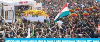  ??  ?? JABALPUR, India: Mourners gather to attend the funeral of Indian Central Reserve Police Force (CRPF) trooper Ashwini Kumar Kacchi yesterday. — AFP