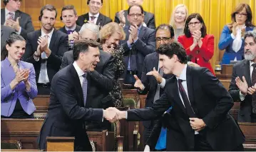  ?? ADRIAN WYLD / THE CANADIAN PRESS ?? Finance Minister Bill Morneau shakes hands with Prime Minister Justin Trudeau after delivering his fall economic statement. In its quest to deliver on promises, the Trudeau government has abandoned its plan of allowing ministers more freedom, with...