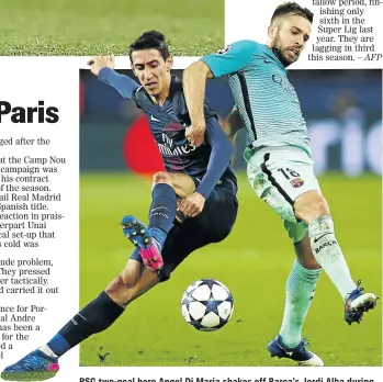  ?? PHOTO: CLIVE ROSE/GETTY ?? PSG two-goal hero Angel Di Maria shakes off Barca’s Jordi Alba during their Champions League tie on Tuesday.