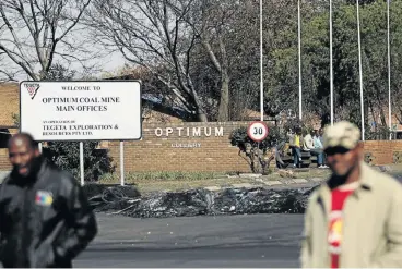  ?? Sandile Ndlovu/Sowetan ?? Minimum survival: Workers at Optimum coal mine went on strike after not being paid for two months. They depend on food parcels delivered by charity organisati­ons, but donations are drying up. /