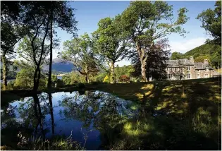  ??  ?? Idyllic: Glenbruach sits on a hilltop with stunning views from the drawing room, top right, and features a cinema, above