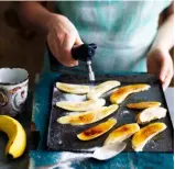  ??  ?? Step 5 Caramelisi­ng the bananas
Hold a blowtorch 10cm above the bananas. Adjust the flame so the inner, darker portion almost touches the sugar; move it in slow, sweeping movements.