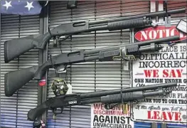  ?? Raul Roa Los Angeles Times ?? SHOTGUNS FOR sale at Arcadia Firearm & Safety. Store owner David Liu says there has been an increase in customers asking about concealed carry permits.