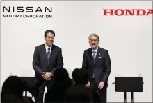  ?? KYODO NEWS - VIA THE ASSOCIATED PRESS ?? Nissan Chief Executive Makoto Uchida, left, and Honda President Toshihiro Mibe in Tokyo on Friday.