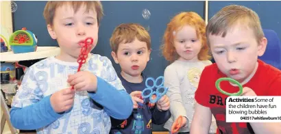  ?? 040517whit­lawburn10 ?? Activities Some of the children have fun blowing bubbles