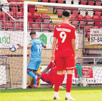  ??  ?? Cheltenham score their opening goal at Leyton Orient - which has been credited as a Sam Ling own goal