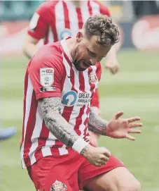  ??  ?? Chris Maguire celebrates his goal that will mean so much to him.