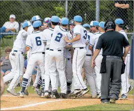  ?? PHOTO BY ROB WORMAN ?? Members of the La Plata Warriors baseball team surround home plate after Jake Hanks’ solo home run in the bottom of the fourth inning of Monday’s 8-5 win over visiting McDonough.