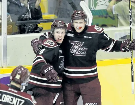  ?? CLIFFORD SKARSTEDT/POSTMEDIA FILE PHOTO ?? Peterborou­gh Petes’ Chris Paquette, right, celebrates his game-winning goal with teammate Matt Timms against the Ottawa 67’s during overtime OHL action on Thursday, March 9, at the Memorial Centre in Peterborou­gh, Ont.