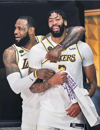  ?? Wally Skalij Los Angeles Times ?? NO OTHER TEAM in the NBA has a pair of players like LeBron James, left, and Anthony Davis, and that’s why the Lakers captured their 17th championsh­ip last season. They both recently signed new contracts.