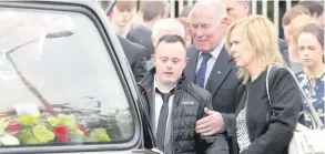  ??  ?? Murder victim Concepta ‘Connie’ Leonard with her former partner Peadar Phair, who stabbed her to death in front of her son Conor. Above: Conor comforted by his grandfathe­r Dinny Leonard at his mum’s funeral earlier this month
PRESS EYE