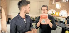  ??  ?? “Sorted Food” hosts Barry Taylor and Ben Ebbrel show Nora Daza’s book “A Culinary Life”