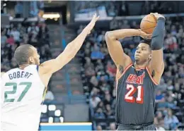  ?? RICK BOWMER/AP ?? Center Hassan Whiteside is glad the Heat’s road trip is over. “It feels like we’ve been on the road for two months now. It’s going to be good to sleep in your own bed,” he said.