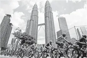  ?? Associated Press file photo ?? Pelli’s Petronas Twin Towers in Kuala Lumpur, Malaysia, were the world’s tallest skyscraper­s from 1998 to 2004.