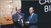  ?? AGENCE FRANCE-PRESSE ?? Caucher Birkar (right), 40, a Kurdish mathematic­ian, receives the Fields Medal Award, math’s most prestigiou­s prize, in Rio de Janeiro, Brazil, on Wednesday.