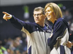  ?? John Bazemore / Associated Press ?? UConn coach Geno Auriemma, left, and assistant head coach Chris Dailey talk during practice before the women’s Final Four in April 2014.