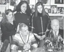  ?? Associated Press ?? Sarra Elizabeth Gilbert, center, is shown standing between her sisters Stevie Smith, left, and Sherre Gilbert, right, on Feb. 12 as her mother Mari Gilbert, seated left, and attorney John Ray hold a press conference about Shannan Gilbert, a Jersey...