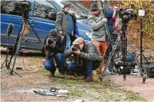  ?? John Stillwell / Associated Press ?? Media members take photos where Prince Philip was involved in an accident Thursday while he was driving. Philip was unharmed. Two passengers in the other vehicle suffered minor injuries.
