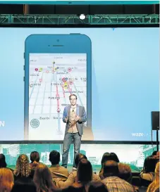  ?? /Brian Ach/Getty Images ?? Leading: A Waze product specialist speaks at LocationWo­rld 2016 in New York. Google bought Waze, a mapping and navigation company, in 2013.