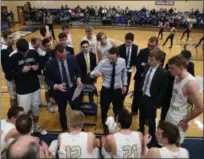  ?? TIM PHILLIS — FOR THE NEWS-HERALD ?? John Carroll huddles during a timeout against Wilmington on Feb. 16 at John Carroll.