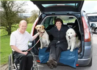  ?? Picture: MOTABILITY.CO.UK ?? Charity founder: Allen and his wife with their Motability Scheme car and assistance dogs